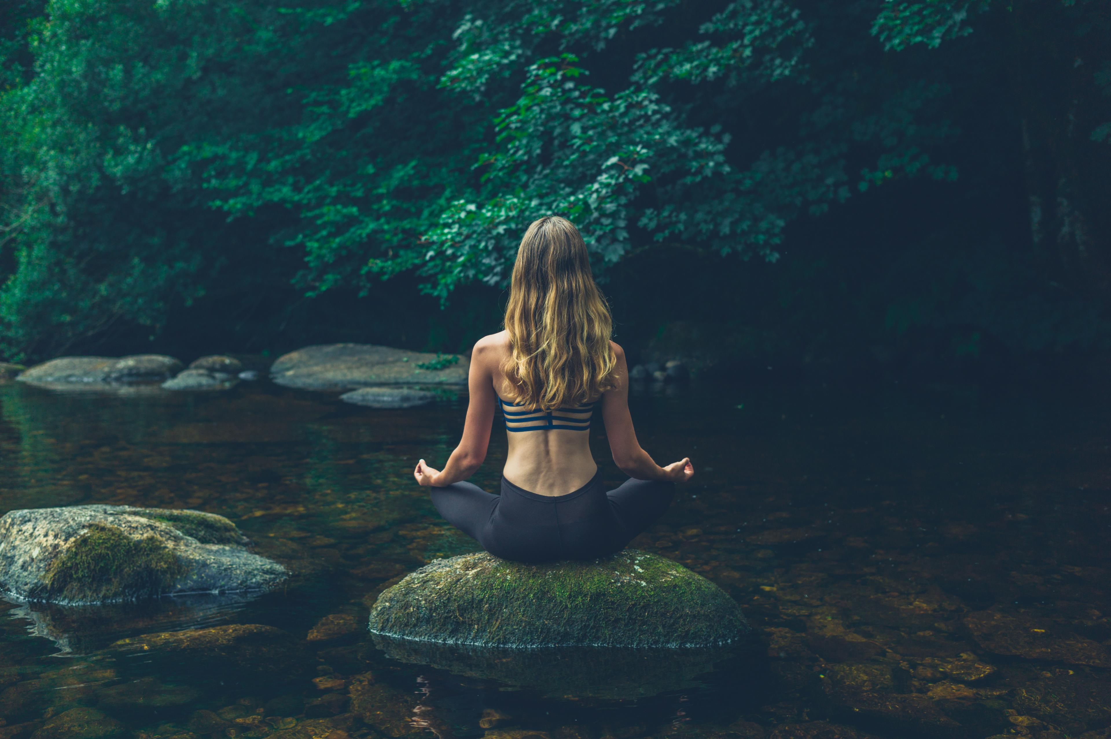 Article Cards Featured Image self care tips hero woman meditating on rock