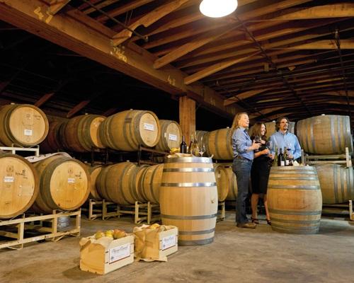 Article Cards Featured Image Winemaker Linda Donovan and guests at the new crush facility.