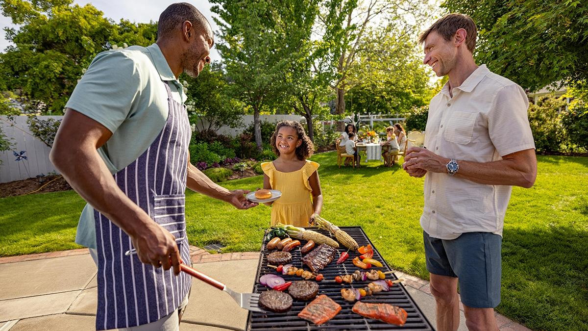 Article Cards Featured Image how to grill young girl with men around grill