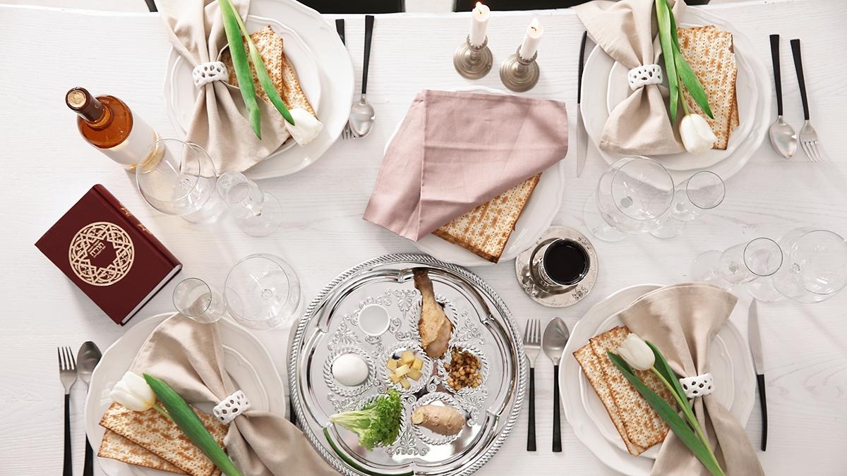 Article Cards Featured Image Festive Passover table setting with Torah, top view. Pesach celebration