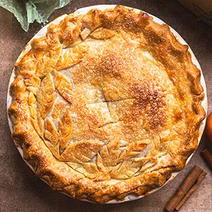 Overhead shot of freshly baked peach pie.